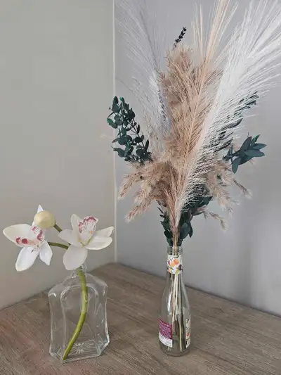 Assortment of dried flowers and pampas arrangements. Sold individually. Prices from $10 - $20. All a...