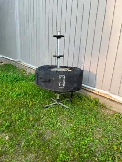 Storage stand for wheels and tires with individual fabric storage covers for wheel/tire. Stand and c...