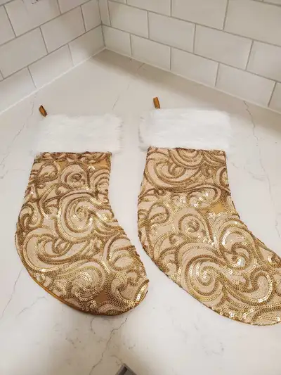 Pair of gold sequin Christmas stockings., View more