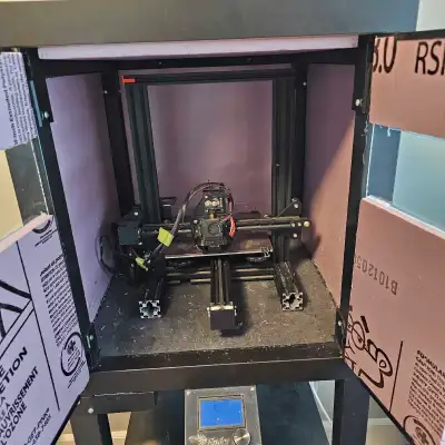 Custom built insulated 3D printer enclosure, with Ender 3 printer. This allows printing of materials...