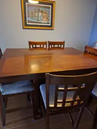 Selling pub style dining table and 8 chairs.