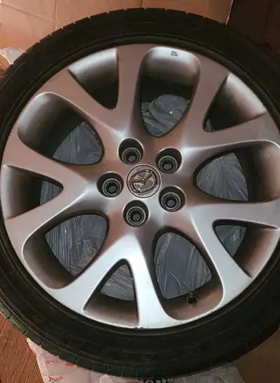 2009-2010 18" Oem Mazad 6 rims and tires in good condition.