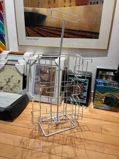 Spinning merchandise display stand. Roughly 30 inches tall and 16 inches wide. Easy pickup Queen/Woo...