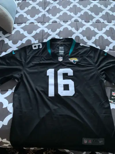 This is a Nike NFL Jacksonville Jaguars jersey, size XXL, featuring the number 16 and Lawrence on th...