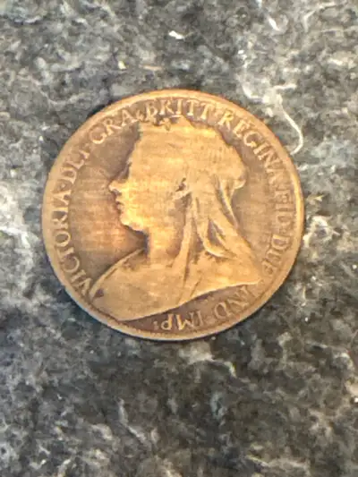 This is an 1897 Queen Victoria one penny coin, a fascinating piece of British history! As you can se...