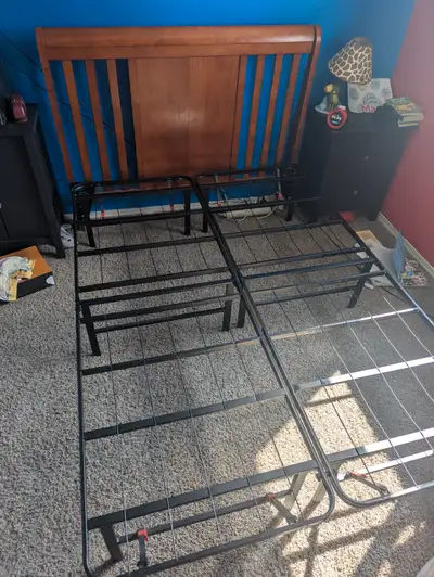 Wooden double bed headboard and metal bedframe with integrated box spring support. Very good conditi...
