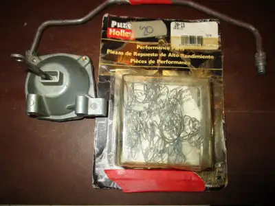 I have several Holley smalls as pictured vacuum pod $20 Ford transfer tube $20 choke kit $50 seconda...