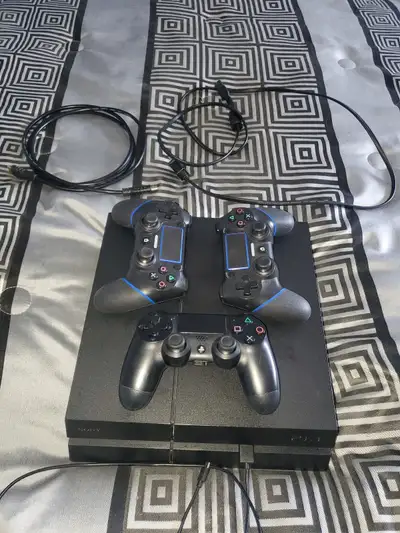Selling a used Playstation 4 with controls and games, View more