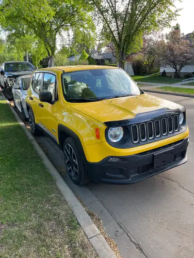 I'm selling a vibrant yellow 2016 Jeep Renegade Sport with front-wheel drive, perfect for city drivi...
