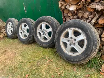 Four 16" Savero 225/70 R16 winter tires on aluminum rims. Rims, 5 bolt, 114.3mm (4.5"), 67mm centre...
