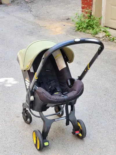 Used Doona travel baby stroller with base, View more