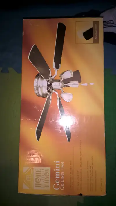 Selling Gemini ceiling fan with 5 reversible blades in maple/black finish - brand new. 42 inch in di...