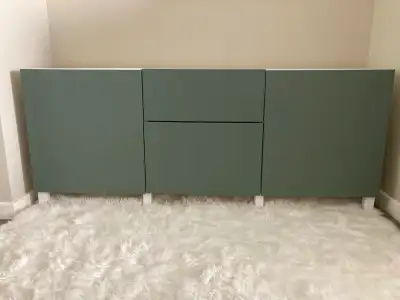 IKEA BESTÅ storage combination with drawers in Krukmakare dark gray-green with Stubbarp white legs....