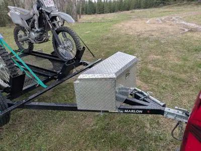 Awesome motorcycle trailer with ramp and diamond plate storage box and side mounted full size spare....