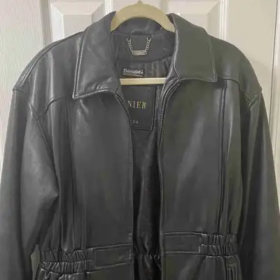 Vintage Women’s Danier leather jacket with cinched waist. Long coat, goes down to about mid thigh. F...
