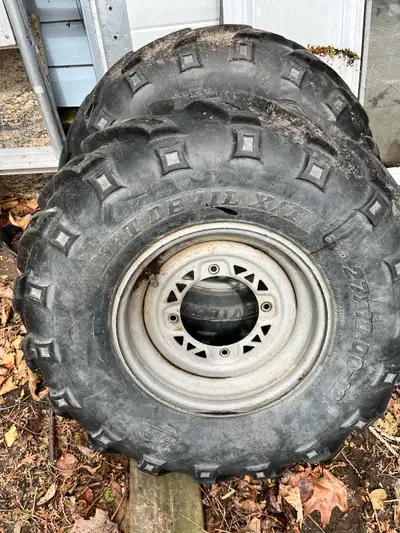 Set of 4 wheels from 2000 Polaris sportsman , 2 tires pretty cracked but all still hold air See pics...