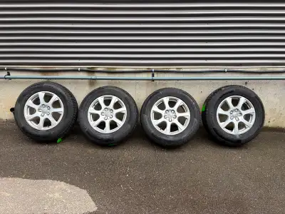Continental 235/65 R17 H. Only used one season. Includes Audi Rims