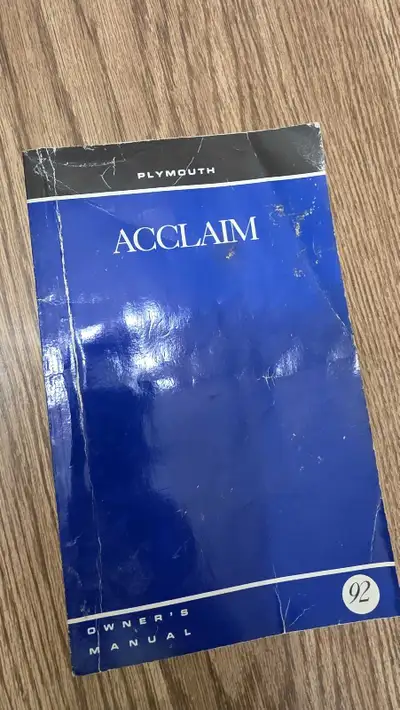 This is a used 1992 Plymouth Acclaim owner's manual. It contains essential information about your ve...