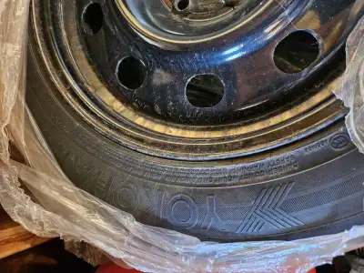 I'm offering 4 Yokohama iceGuard iG52 winter tires, size 235/55R17 99T, mounted on black steel rims....