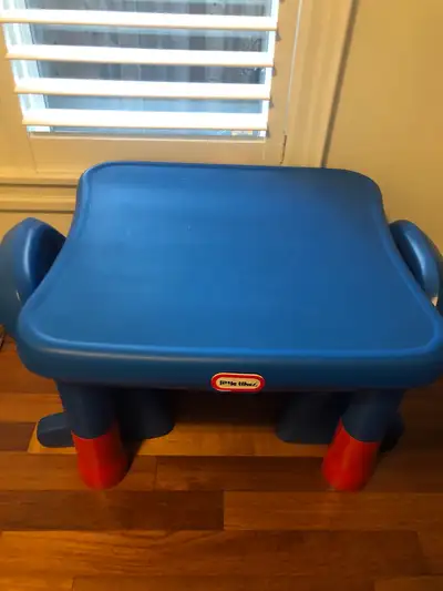 This Little Tikes table and chairs set is perfect for toddlers, featuring a sturdy blue table and tw...