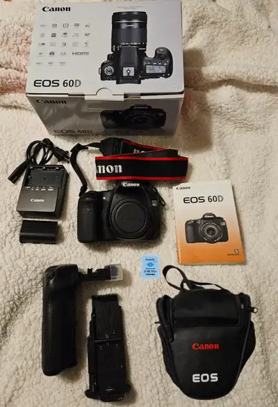 Canon 60D DSLR Camera Includes the following: Canon 60D DSLR Charger Battery LP-E6 Neck strap Batter...