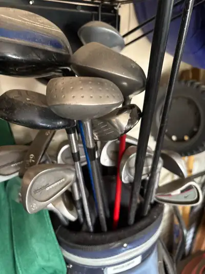 Assorted Golf Clubs and bag, View more