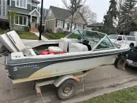 Boat with motor and trailer