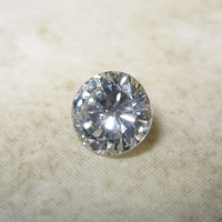 Diamond, round brilliant, 0.31 carat, with evaluation report