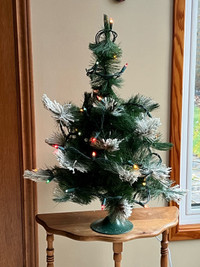 Miniature artifical snow-tipped Christmas tree