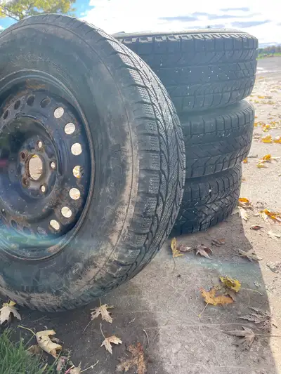 Set of 4 BF Goodrich Winter Slalom snow tires on rims 215/70R16 5 bolt pattern Asking $400