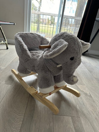Grey elephant rocking chair.