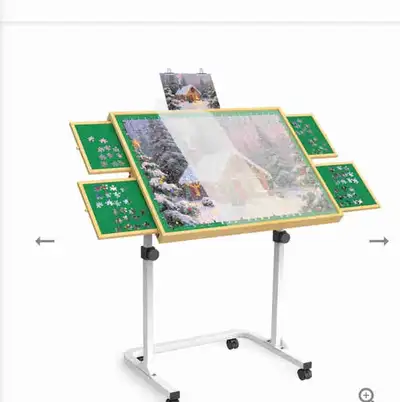 Fully adjustable puzzle table, with drawers for extra pieces. Table size 35”x 26”. Top tilts and tel...