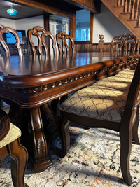 Solid wood dining table  eight chairs and matching cabinets