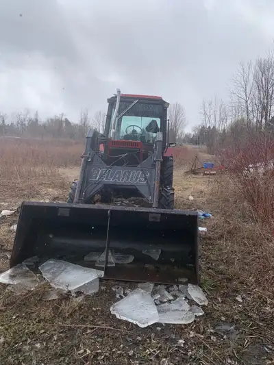 85 hp Belarus tractor, 4 Wheel Drive, with a loader and PTO, in good condition, new batteries, and n...