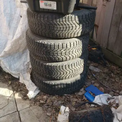 Set of 4 Rims and tires. Steels rims. Winter tires. Not LT Dot 1215 Bridgestone tires M and s 17 inc...