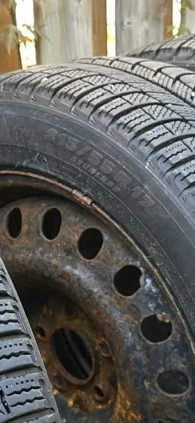 Used winter tires on metal rim (rusted) but tires in good condition.
