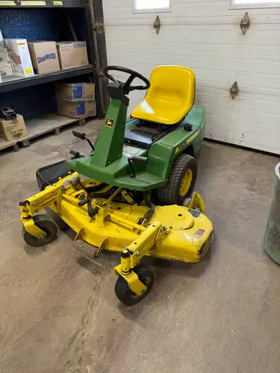 John Deere F525, 48" deck, one of the original "zero turn" mowers. Has some comsmetic issues but not...