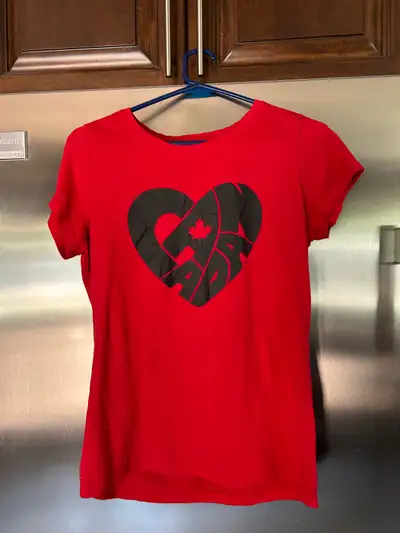 Show your Canadian pride with this EH! Canada red T-shirt, perfect for Canada Day or any day you wan...