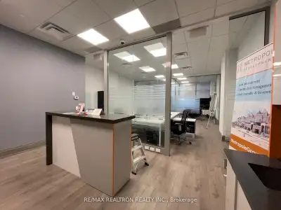 An upscale office unit provides an ideal setting for medical or legal professionals within a triple-...