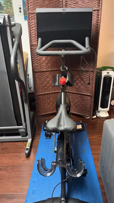 Elevate your home fitness routine with this pre-owned Peloton Bike+ which features an immersive rota...
