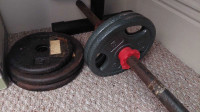 Metal barbell bar with various weights 