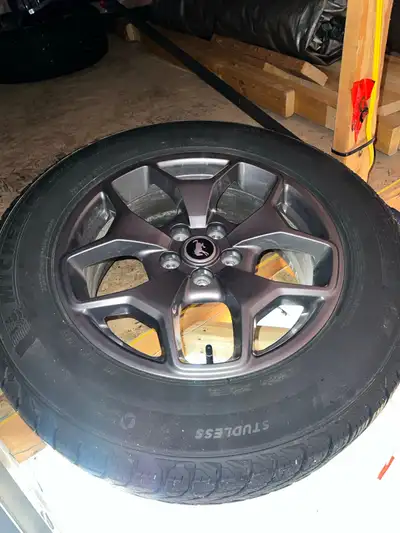 A set of Ford OEM rims with Ford Wheel nuts and locks, and Tire Pressure monitor sensors installed....