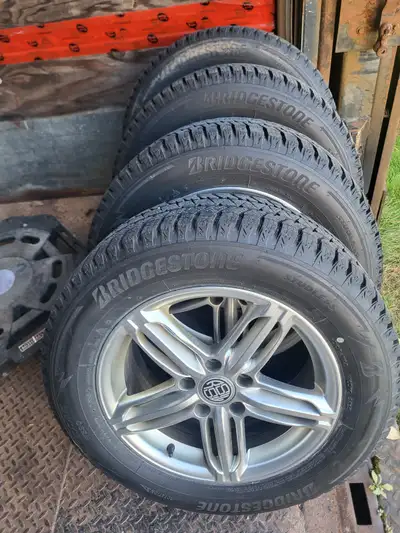 Winter tires and rims, set of 4. Bridgestone BLIZZAK 215/60R16, bolt pattern 5 X 112 Used two season...