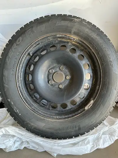 Perelli Ice Zero R 215/65 R17 Used for 3 winters only; 15km run in total. Rims included. No reasonab...