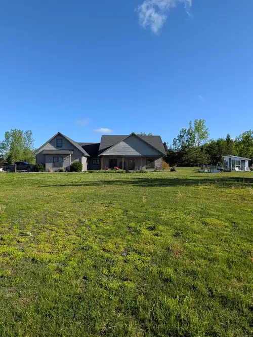 Experience country living in this beautifully crafted custom bungalow, built in 2016 and perfectly p...