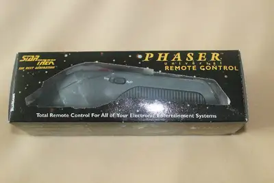Here is a classic Star Trek The Next Generation remote control unit. In addition to controlling TV f...