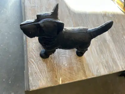 Plaster one $30 Cast iron dog $40 1/2 cast iron $40