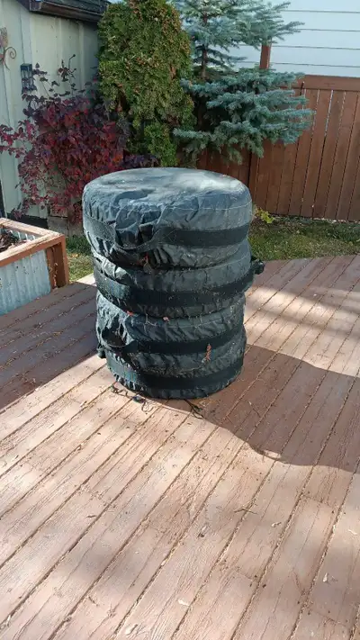 Set of four winter tires on rims. 235 55 R17 toyo tires. New last winter. Mounted on steel rims