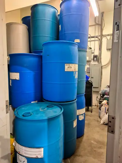 Durable 55-gallon (208-liter) plastic drums, many available, ϕ23” by 36.5” high, closed top with TWO...