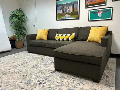 This Crate and Barrel charcoal grey sectional sofa offers deep comfort with its L-shape design and i...